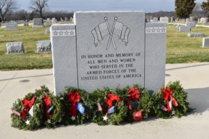 Monument decorated with wreaths at the Wreaths Across America Ceremony