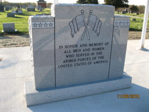 Veterans monument inscribed with "In honor and memory of all men and women who served in the armed forces of the United States of America"